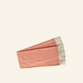 A red woven throw blanket with a checkered pattern and fringe detailing.