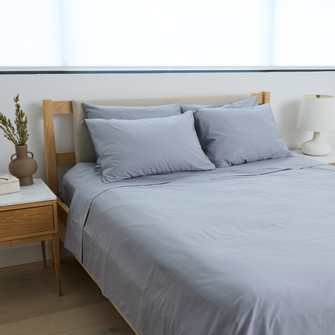 Bed made with the Pewter cooling sheets from Slumber Cloud ––Performance Cotton Sheet Set.