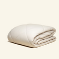 The All-season UltraCool Comforter folded in the sand color