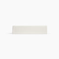 Avec linen fitted sheet in bone folded neatly on a white background