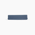 Avec linen fitted sheet in harbor folded neatly on a white background