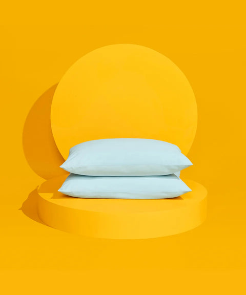 The Slumber Cloud UltraCool Pillow stacked on a yellow pedestal