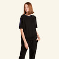 Woman wearing the Slumber Cloud Essential Raglan Pullover made with Outlast temperature regulation technology